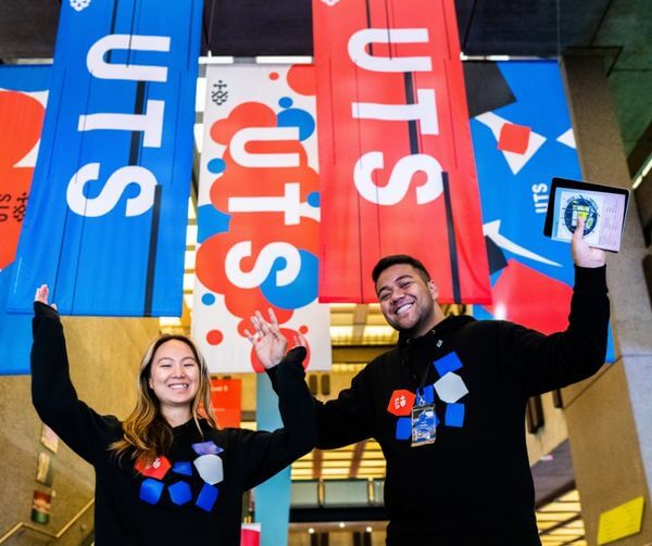 2 Students standing tall in UTS Banners