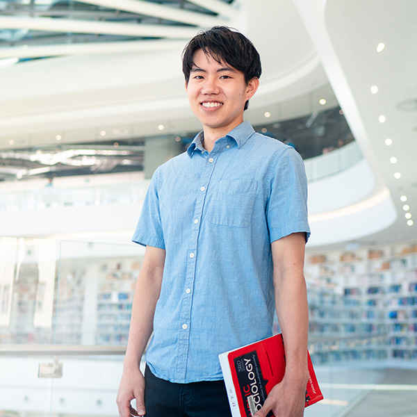 UTS Student smiling in Library